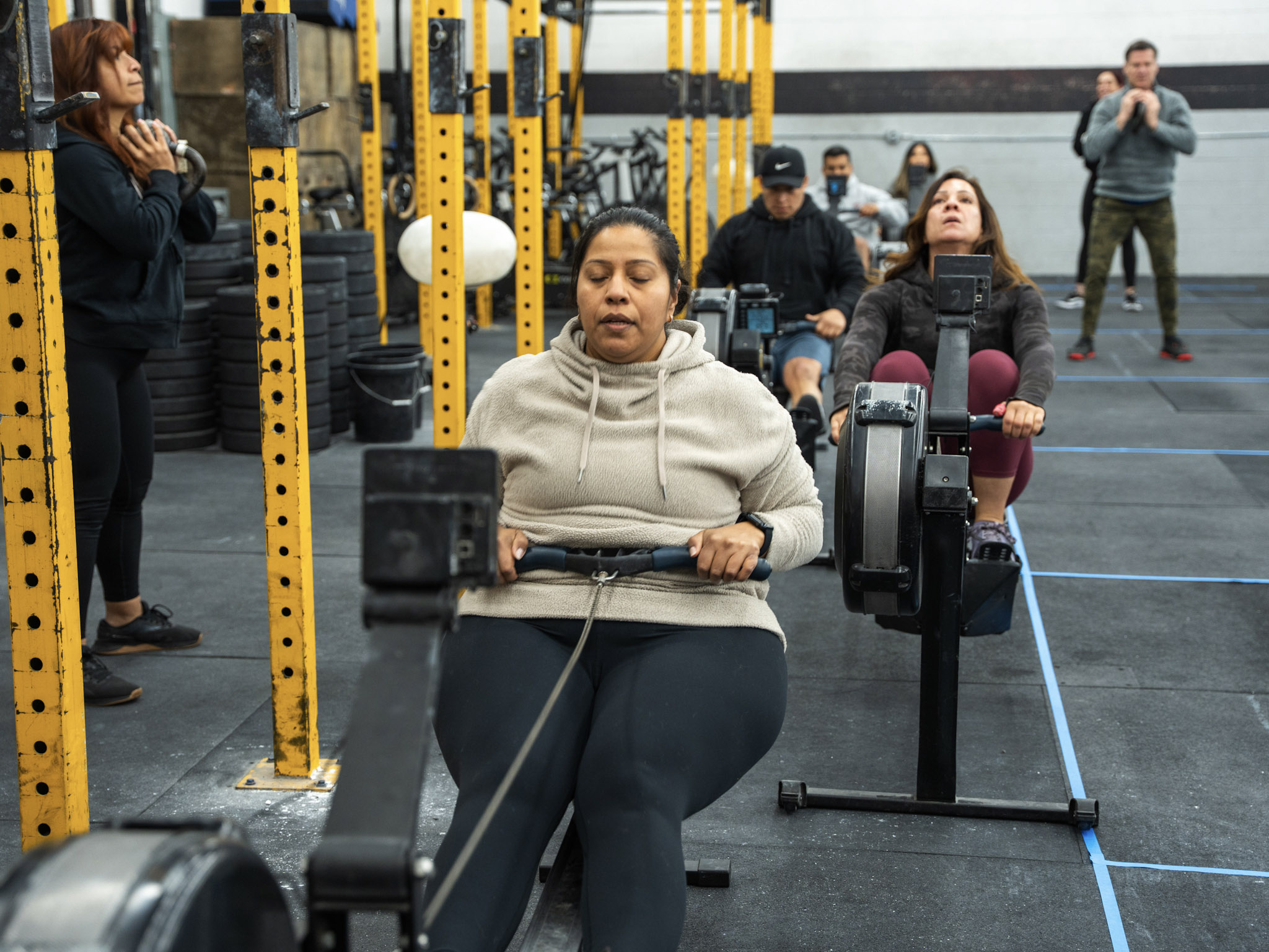 Team RepScheme member training on a rowing machine
